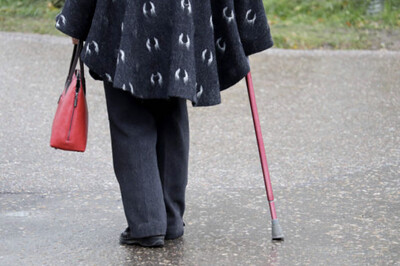 elder person walking with cane