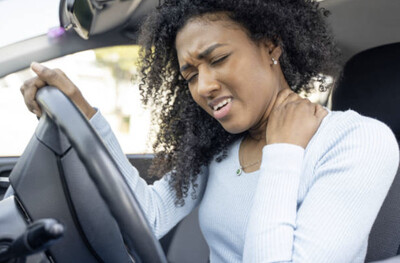pinched nerve in neck of woman driving car