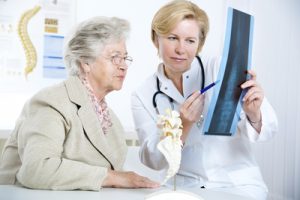 elderly spine surgery dr talking to elder patient